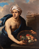 Junger Mann mit einem Früchtekorb